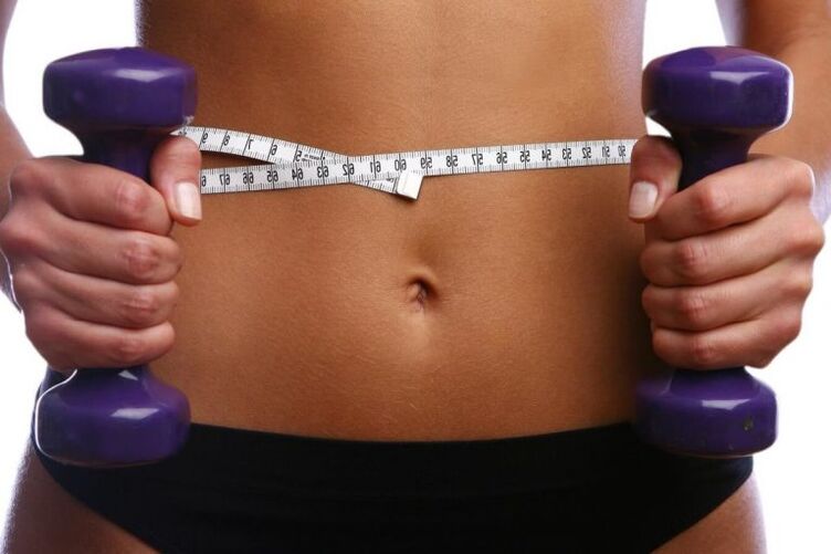 Fitness dumbbells in the hands of Fit Girls